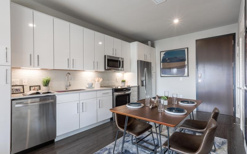 a kitchen with white cabinets