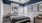 a bedroom with a bed and a fan