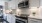 a kitchen with white cabinets