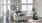 a living room with a couch and chairs